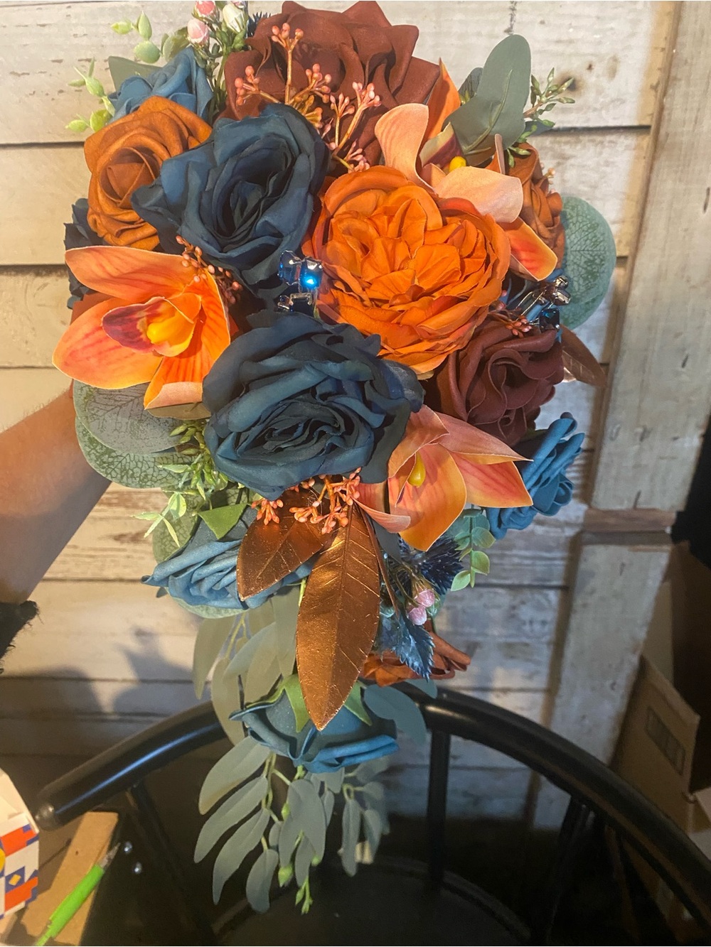 Teal and Orange Floral Bouquet cascade style with matching boutonnière